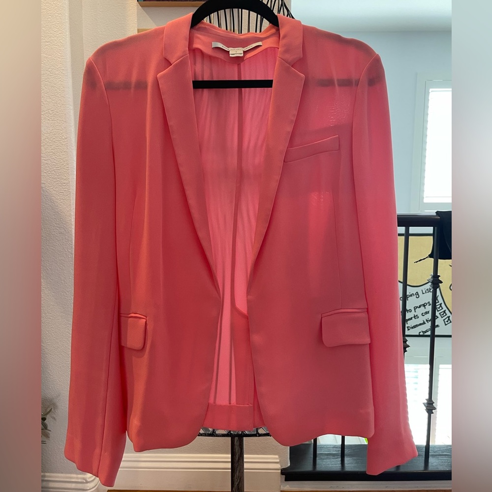 Coral,lightweight. Unlined and slightly sheer. Perfect for those summer nights!